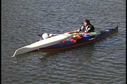 first paddler now begins to recover second paddler's kayak
