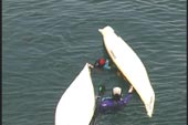 In bow to stern position first paddler does a wet re-entry