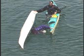 second paddler rolls up using bow of first paddler since kayaks are parallel