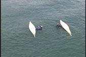 two capsized kayakers
