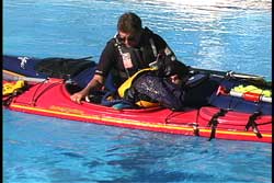 kayak upright with victim in cockpit face down