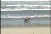 paddler puts kayak on edge