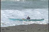Kayak now parallel to ocean due to surge water