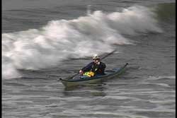 wave approaching kayak from side
