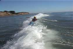 paddler still upright after wave breaks