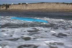 kayak upside down in surf zone