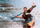 wayne in kayak bracing and waving